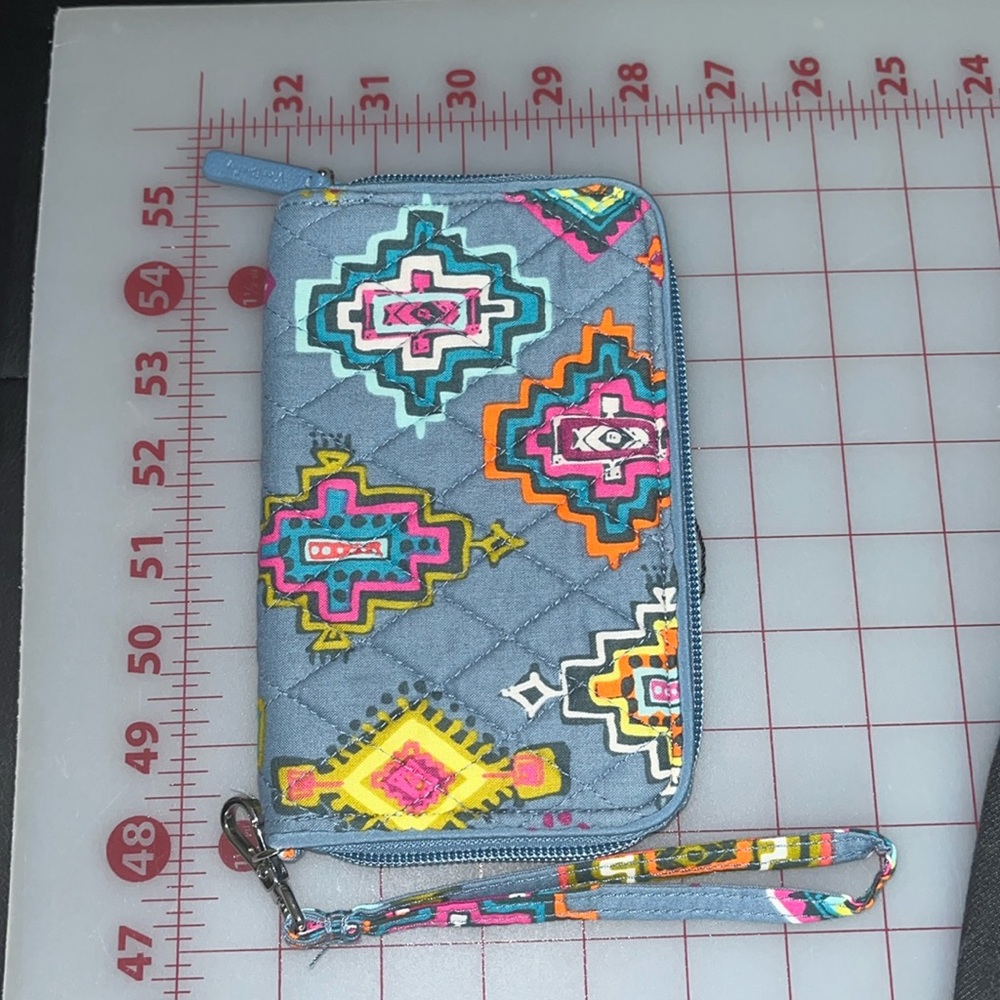 New Vera Bradley blue, cotton wallet. Aztec designs. Wrist strap. Holds phone.